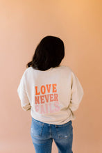 Load image into Gallery viewer, Love Never Fails Pullover